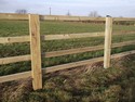 Horizontal wooden slat farm fencing